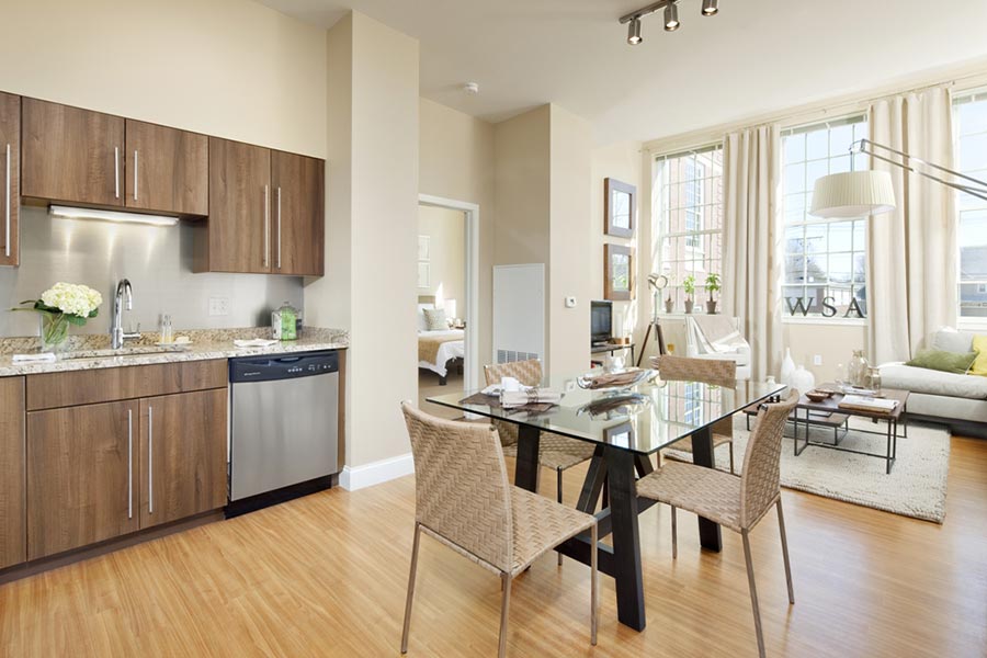 Kitchen Cabinets: Elegante (Slab) in Amati Walnut Thermofoil in Wilber School Apartment